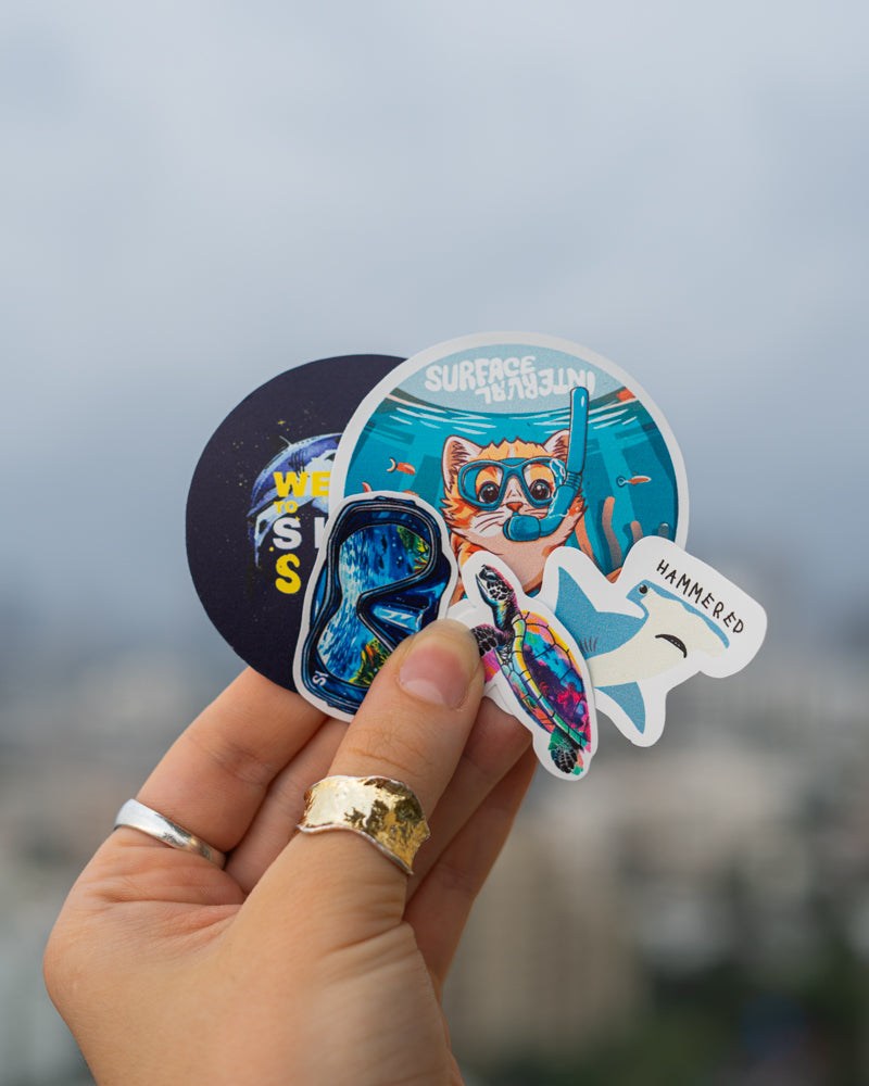 Surface Interval Sticker Pack (Pack of 5)Due to popular demand here is our sticker pack! 
Drawing inspiration from the ocean and all surroundings our sticker pack embodies the love and excitement we get froSurface Interval Sticker Pack (PackSurface Interval