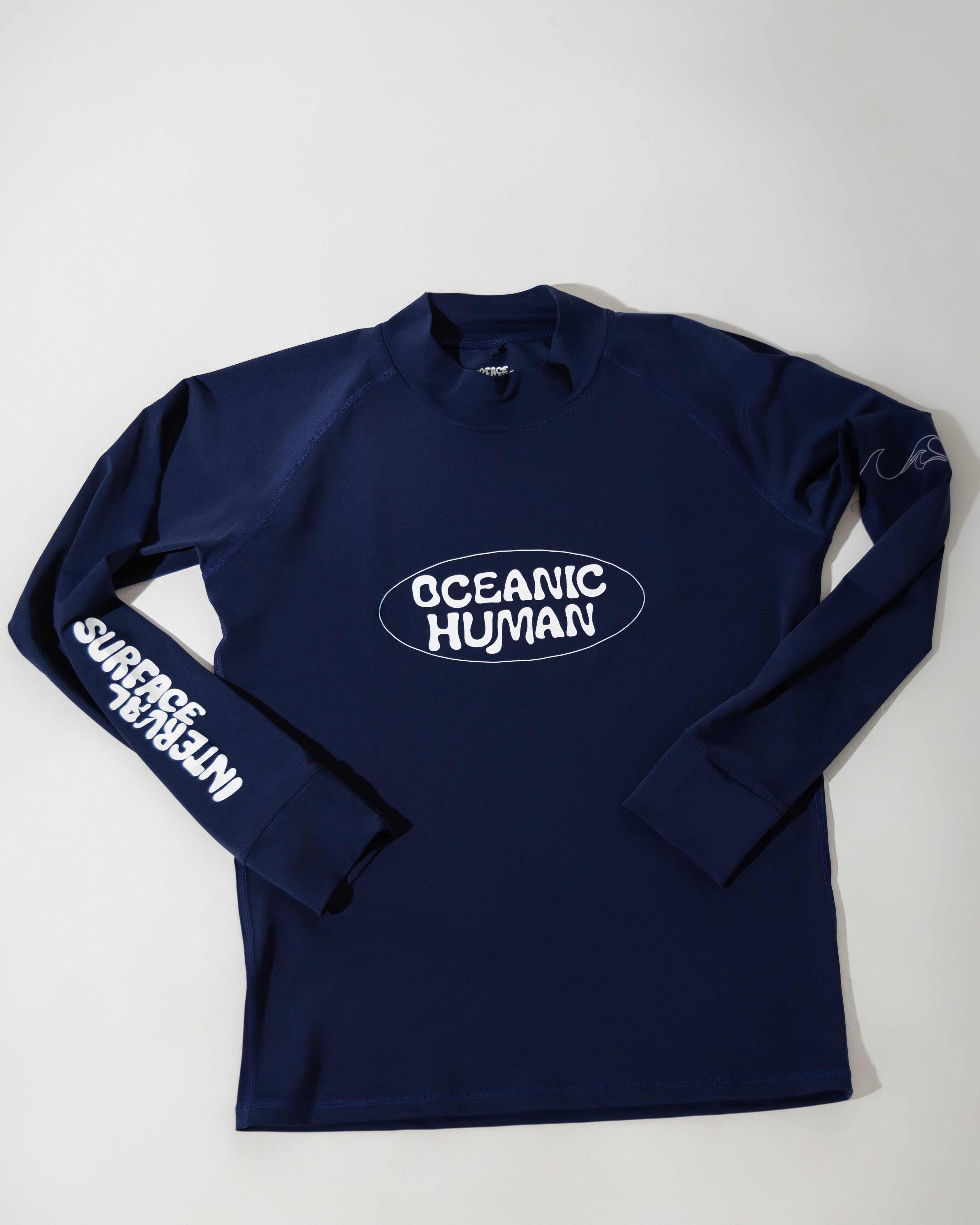 'Oceanic Human' RashguardFor the Ocean, From the Ocean
Our rashguards are a tribute to the ocean's beauty and resilience. Crafted from single-use plastics, ghost nets, and recycled ocean was'Oceanic Human' RashguardSurface Interval