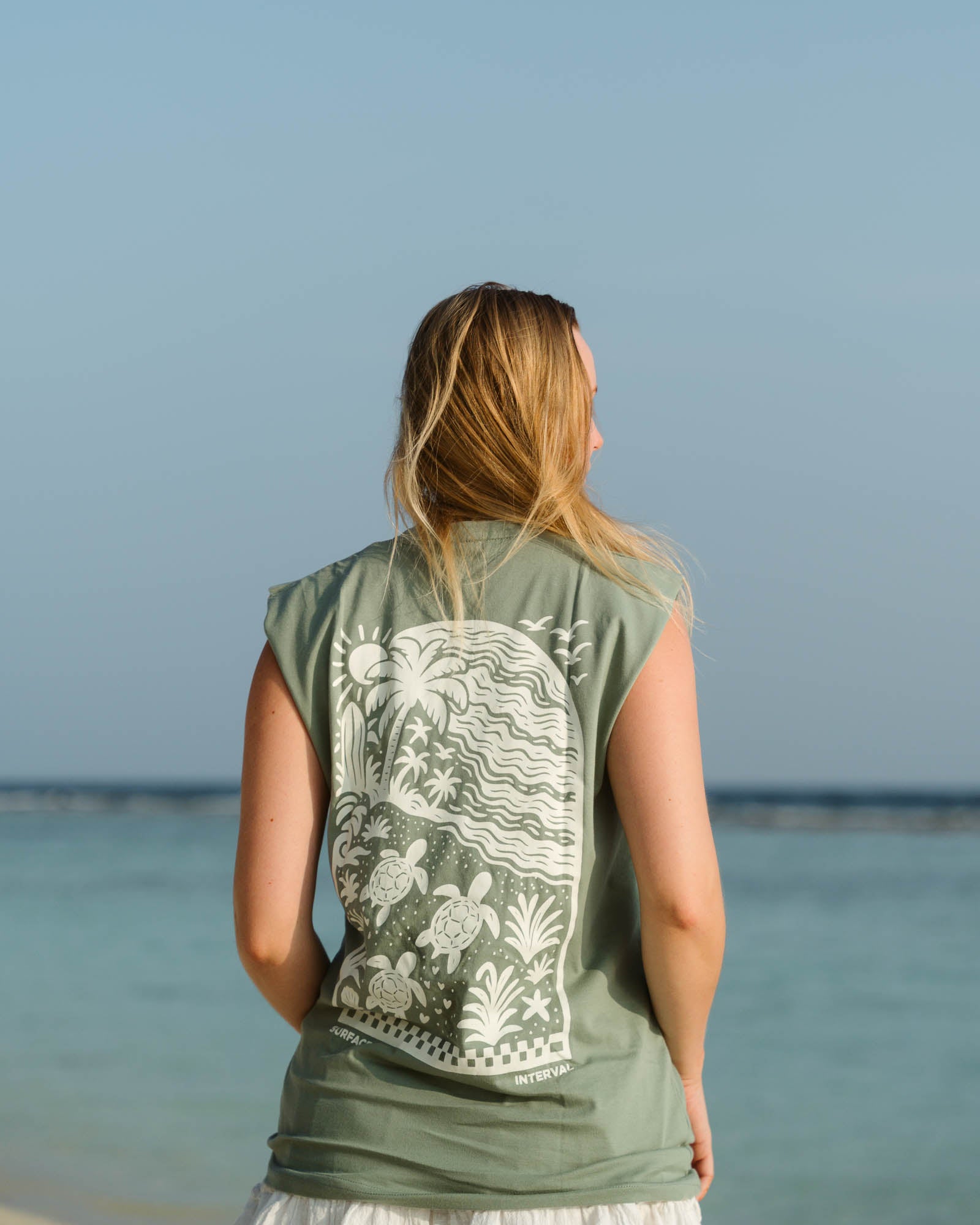Woman wearing the Slow Living Tank Top styled casually for a calm day outdoors