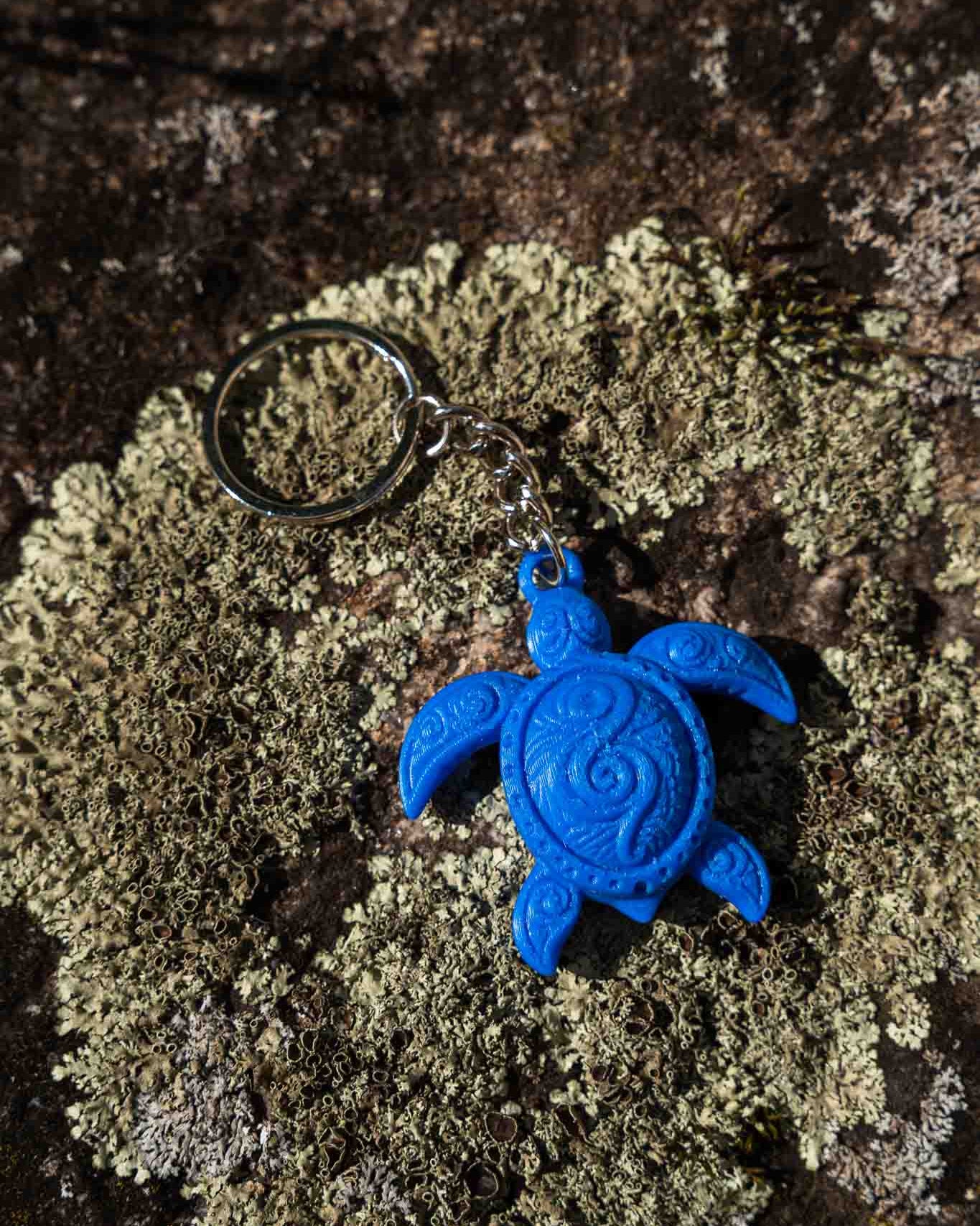 A bright blue sea turtle keychain 
