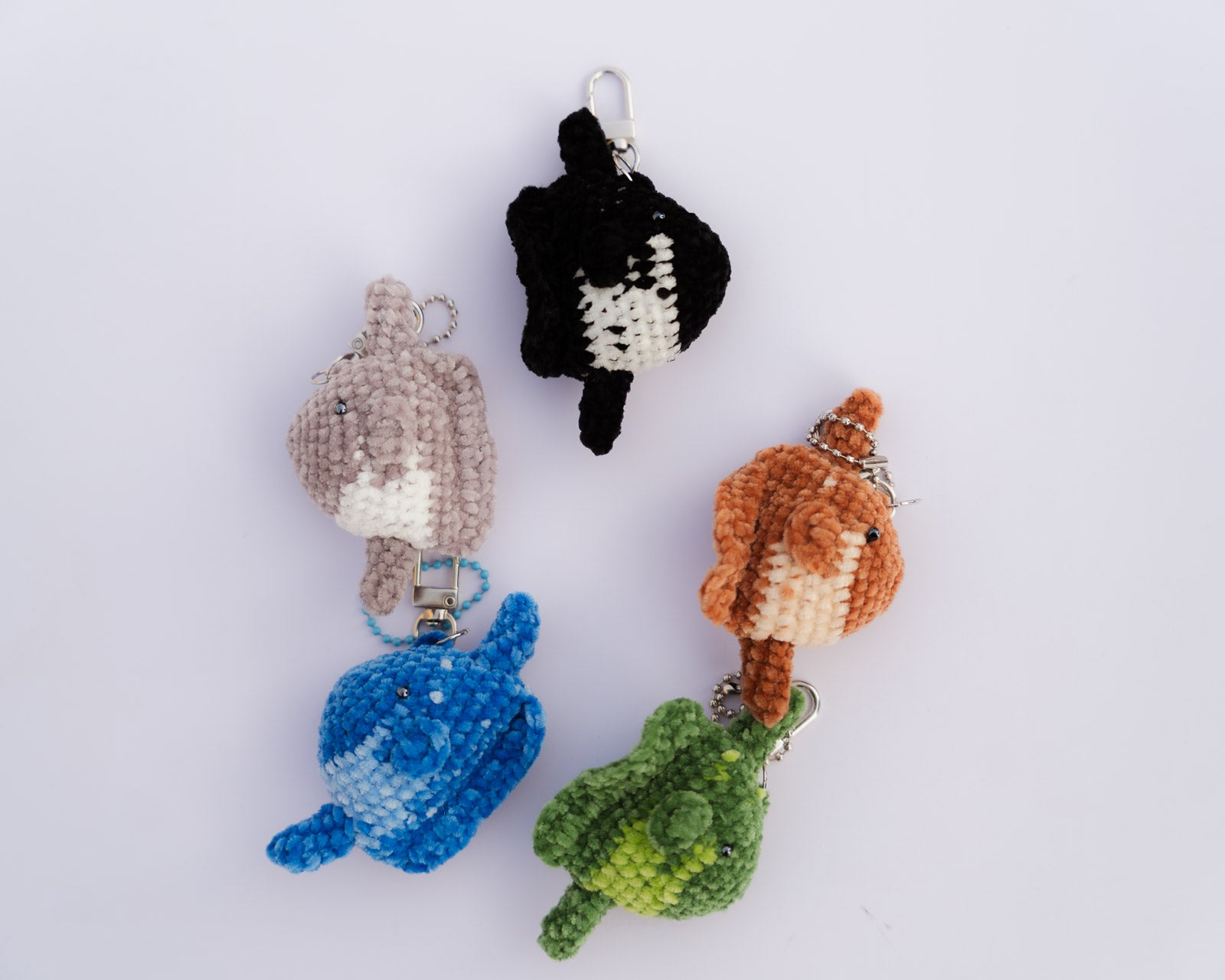 Collection of colorful crochet keychains mola molas