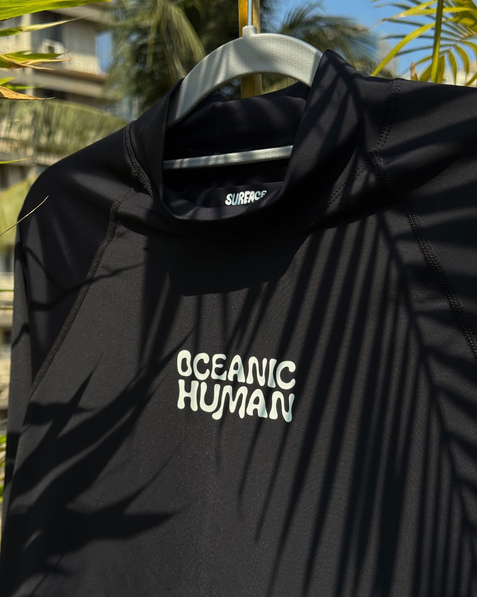 Close-up fabric detail of Oceanic Human Rashguard 2.0 made from regenerated ocean plastic nylon