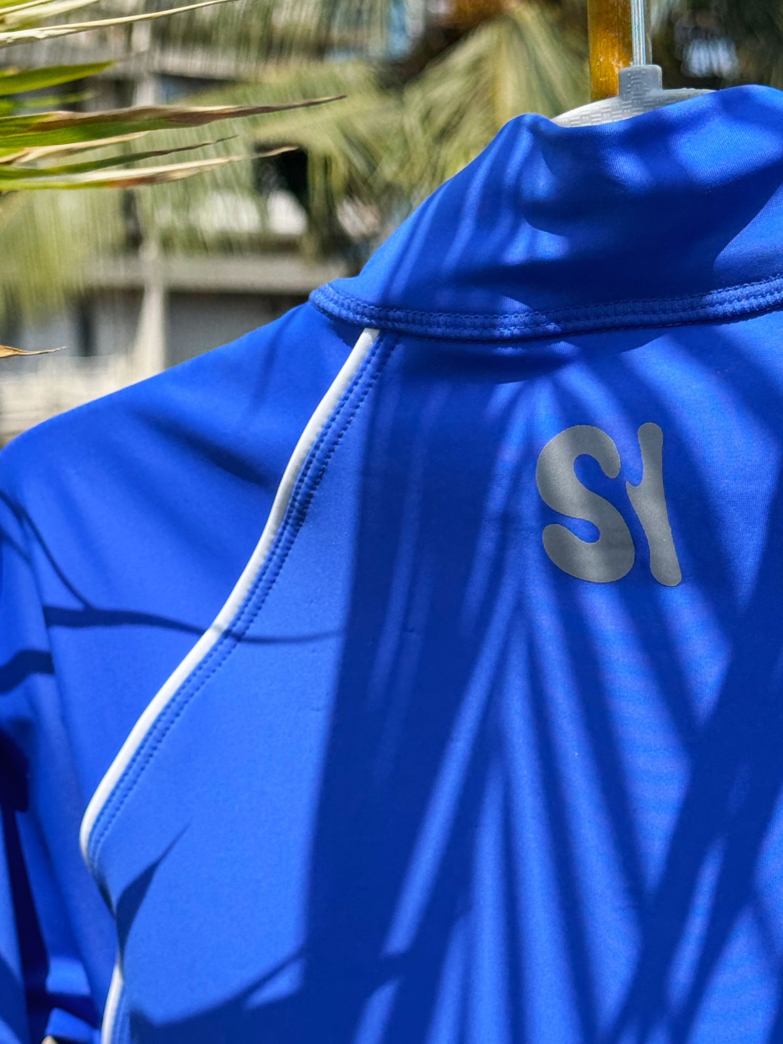 Close-up of Blue back detail on SI One-Piece Rashguard women's sustainable rashguard 